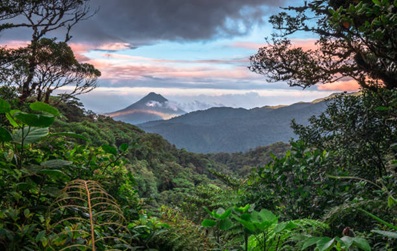 Costa Rica view of Arenal Volcano with rainforest and sunset