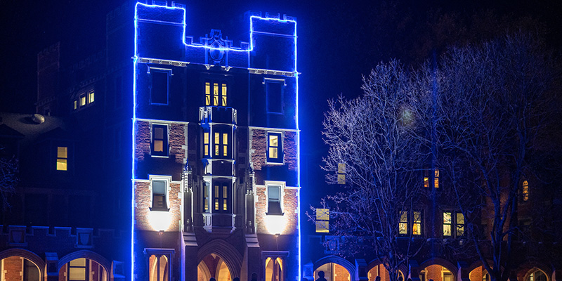 Gates-Rawson Tower is aglow for the holidays.