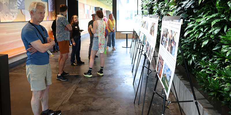 eunion attendees read the displays at the Renfrow Hall residence hall.
