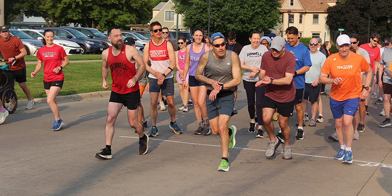 Runners take off from the starting line on 10th Avenue during the Alumni Fun Run/Walk.