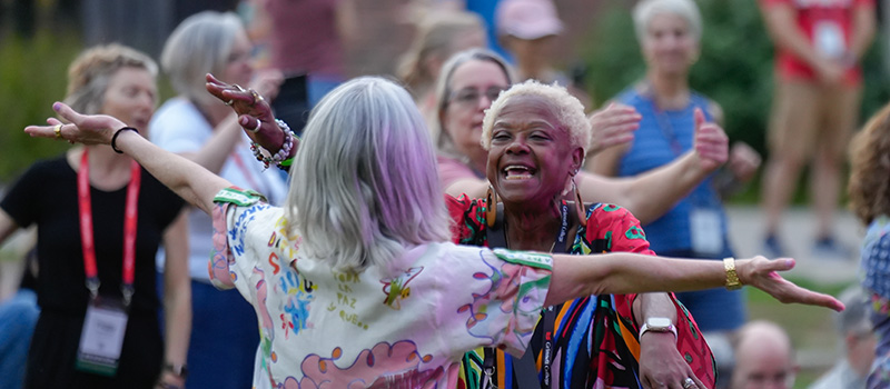 Althea Ricketts &rsquo;86 hugs a classmate.