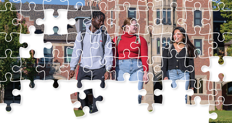A picture of students walking on campus is broken up like a jigsaw puzzle