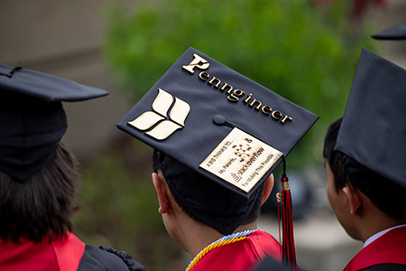 A commencement cab features the Grinnell College Laurel Leaves Logo and a thank you message for the wearer's parents. 