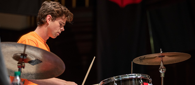 Declan O’Reilly ’21 plays drums during the Medallion Ceremony Fall 2019.