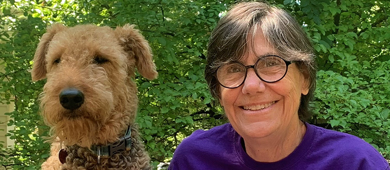 Susie Kaeser ’69 poses with her dog. 