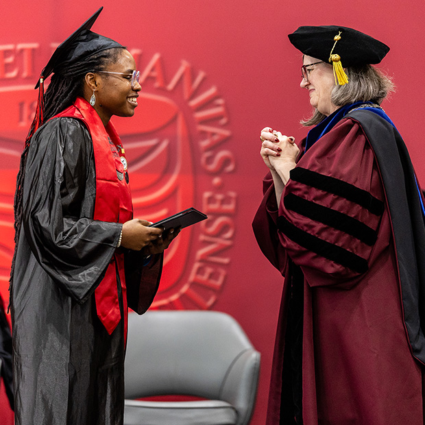 Anu Sanumi &rsquo;26 receives her diploma from President Anne F. Harris