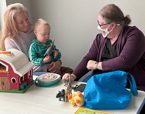 Kathryn Russell &rsquo;98, right, works with one of her students.