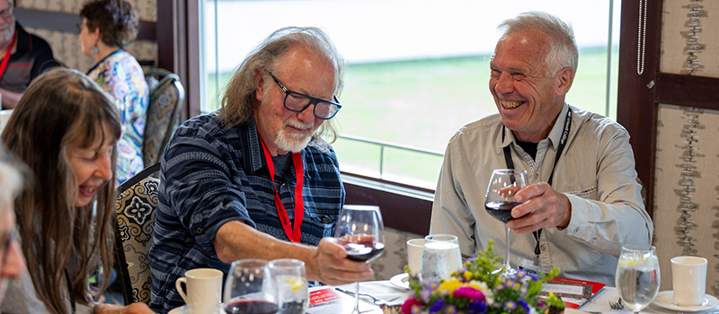 Members of the class of 1975 share a laugh during their Reunion class dinner.