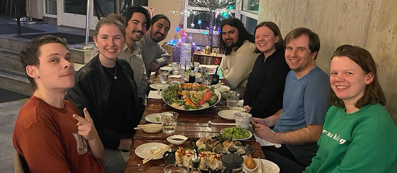 A group of Seattle Grinnellians meet for dinner and pose for a picture.
