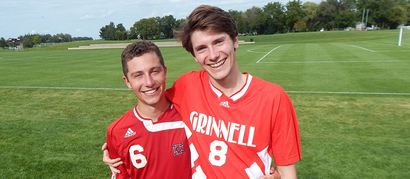 Artis Curiskis ’18, left, and Antonio DiMarco ’18 pose for a photo after the 2019 soccer alumni game.