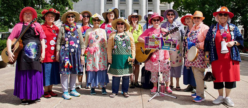 The Madison chapter of Raging Grannies poses for a group shot during an event last year holding guitars and drums. 