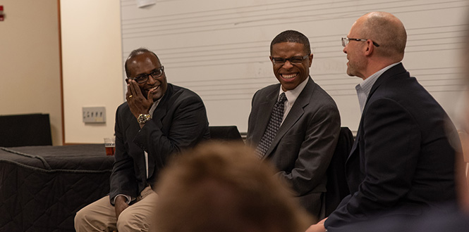 Ravi Rajagopal, left, and Sherman Willis ’01 share a laugh with Mark Peltz, dean of Careers, Life, and Service; during a panel discussion about creating a successful business career with a liberal arts degree.