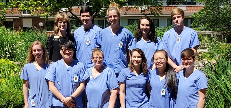 Health professions career community students take a group shot following certified nursing assistant training.
