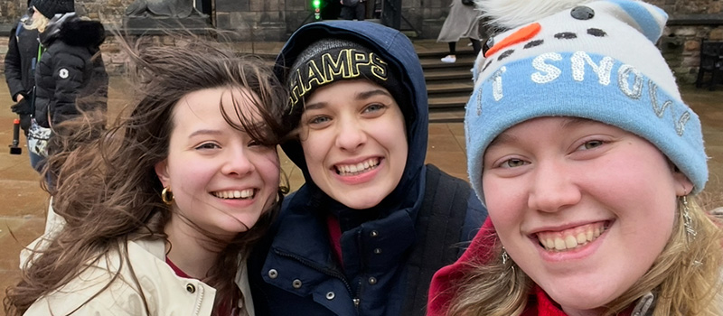 Clara Bode ’26, right, is joined in a photo by Beatrice Crist ’25, left, and Alyssa Argent ’25.