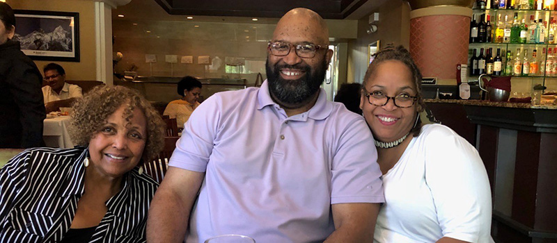 Darrell Scott ‘87, center, is joined by his mother-in-law Barbara Townsend, left, and his wife, Kimberly Townsend-Scott ’88 at a family dinner. 