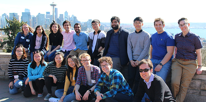 Students on the STEM trek spring break trip gather for a group photo with the Seattle skyline and Space Needle in the background.