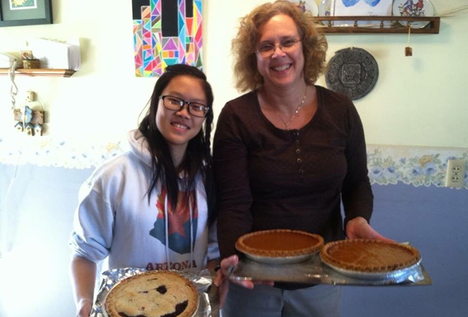 Trang Nguyen ’17 and Connis Dayton baked pies for a Thanksgiving meal at the Dayton's house.