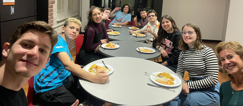 Students from Brazil enjoy a meal Coelho de Lima organized when she visited Grinnell.
