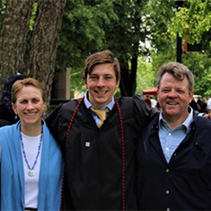 Lynn and Gene Dixon-Anderson flank their son Ian at Ian's commencement at Grinnell College.