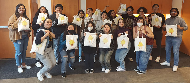 Members of the Grinnell College’s Student Organization of Latinxs (SOL) display care packages.