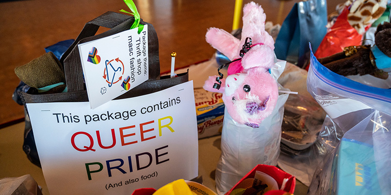 A selection of care packages with one proximately displaying it was created for a member of the LGBTQIA+ community.  