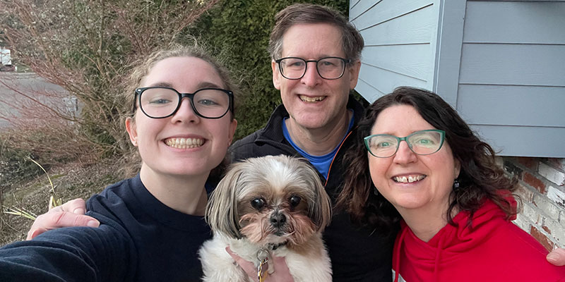Adrienne Gassaway &rsquo;28, left, poses with her parents, David Gassaway &rsquo;91 and Jennifer Jones Gassaway &rsquo;93, and the family dog, a Shihtzu mix named Florence.