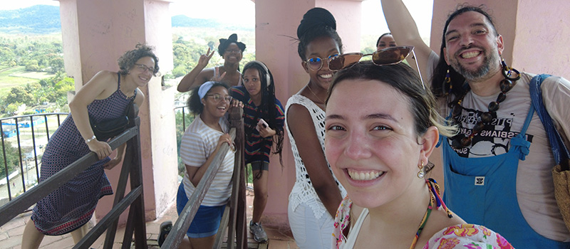 Fredo Rivera, assistant professor of art history, right, is joined by GLP students in Cuba.