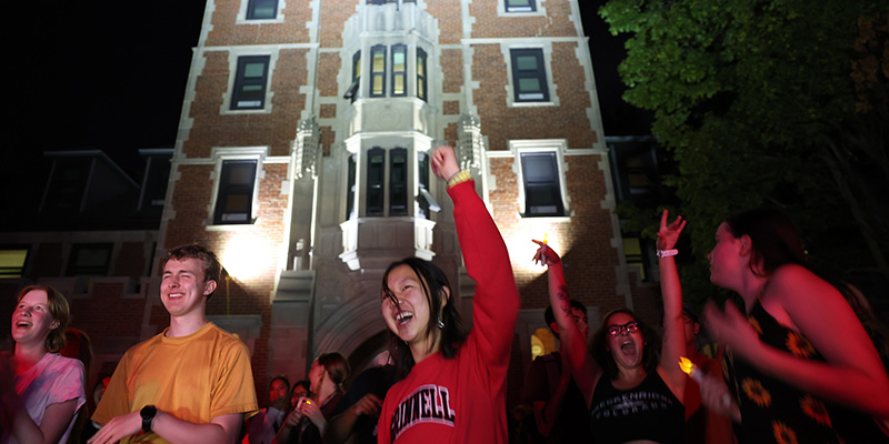 Students dance in front of Gates-Rawson Tower.