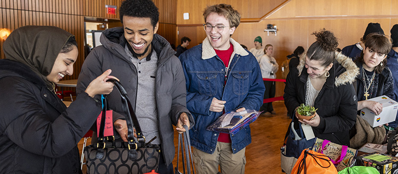 Students selecting care packages.