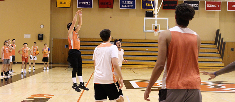 A disguised Jack Taylor ’15 launches a 3-point shot.