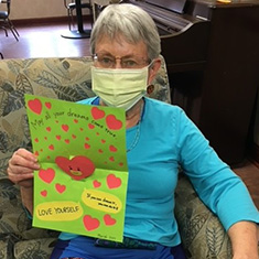 Mayflower resident Kay Roberts displays one of the cards she received last year from students of the International School of Düsseldorf in Germany. 