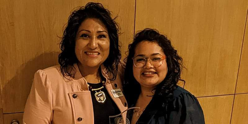 Abarca poses for a picture with Sonia Reyes, executive officer of the Iowa Office of Latino Affairs.