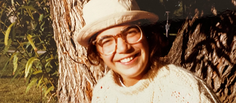 In a photo from her Grinnell College student days, Silano is studying plant taxonomy.