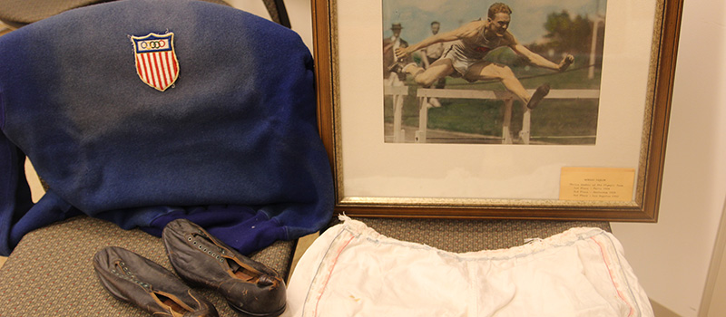 A USA Sweater, cleats, running shorts, and picture owned by Frederick Morgan Taylor 1926.