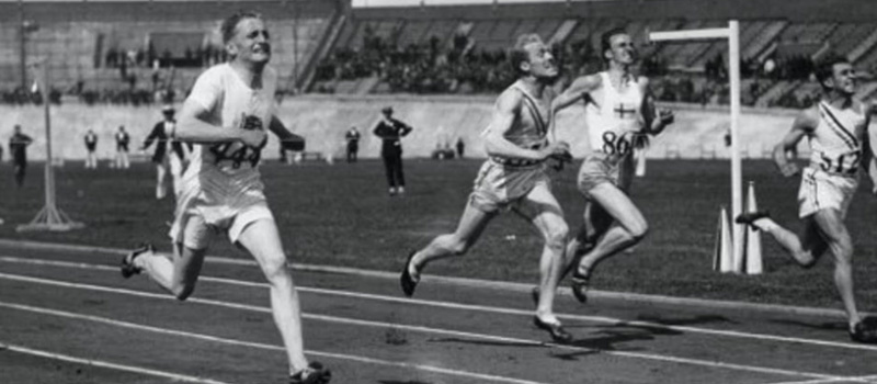 Frederick Morgan Taylor 1926 crosses the finish line at the US Track and Field trials in 1924.