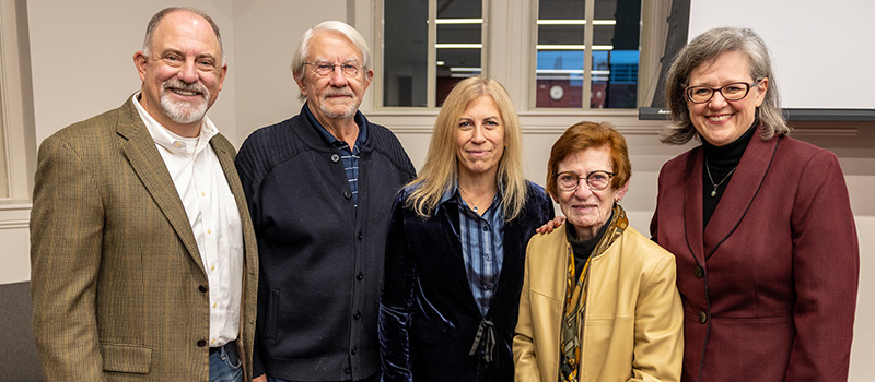 Nancy Schmulbach Maly ‘61, second from right, is joined by her husband Allan Maly; her son, Layne Maly ‘90; her daughter, Alix Maly Marsters ’91; and  Grinnell College President Anne F. Harris
