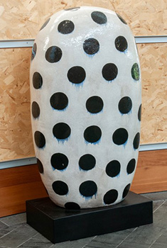 Dumpling, a four-foot tall, beautifully quirky white ceramic piece with black polka dots, by the Japanese-born, Omaha-based artist Jun Kaneko