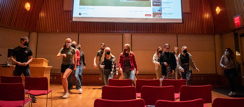 A line-dancing group and audience members groove to a Blake Shelton song at the Talent Swap during National Philanthropy Week.