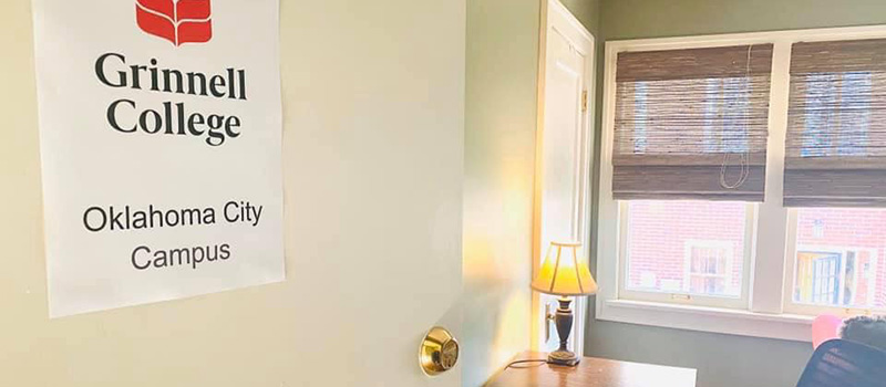 Sign on a door at a student's home. Text: Grinnell College Oklahoma City Campus