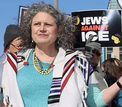 Rachel Weiss &rsquo;98 is pictured at a protest.