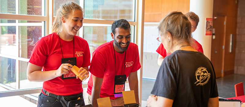 Student workers assist a Reunion attendee during Reunion 2019. 
