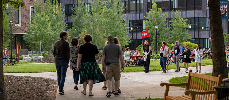 Alumni walk through central campus during Reunion Block Party during Reunion 2025.