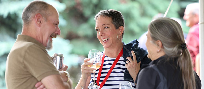 Three classmates catch up during Reunion 2025.