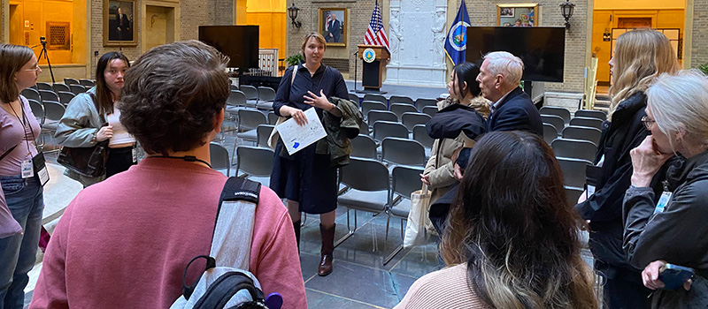 Toby Cain ’12, chief of staff for the Risk Management Agency, shows students around the U.S. Department of Agriculture offices.
