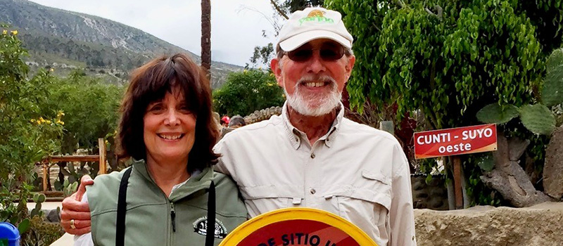 Steve Shender ’67 and his wife, Cathy, stand at the equator during a post-retirement vacation to Ecuador.