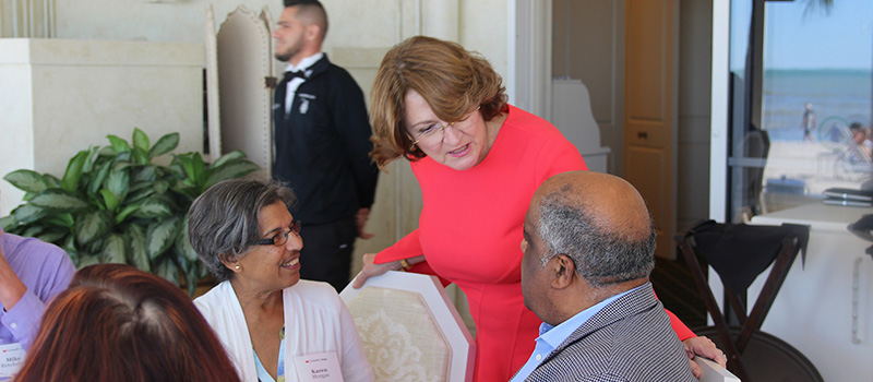 Susan Holden McCurry &rsquo;71 visits with Dr. Randy Morgan &rsquo;65 and his wife, Karen Morgan, 