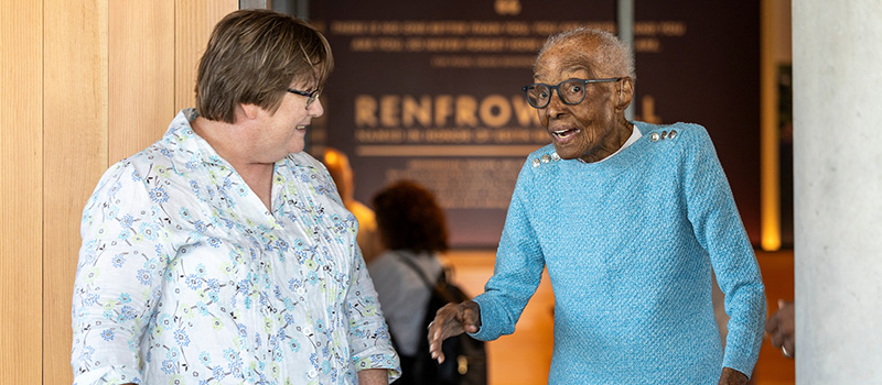 Monique McLay Shore ’90, left, visits with Mrs. Edith Renfrow Smith ’37, DHL ’19 