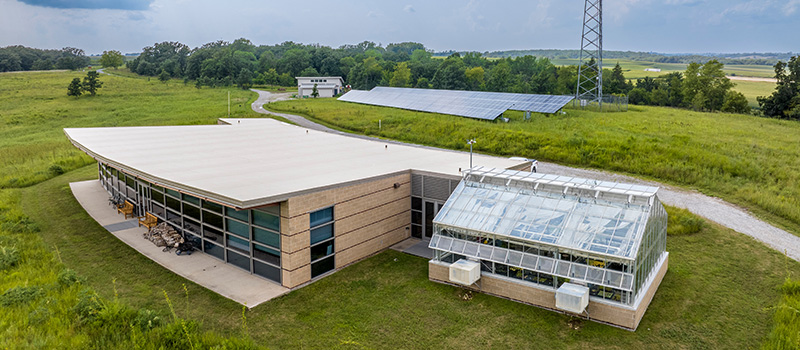 The learning center at CERA featuring solar panels in the background.