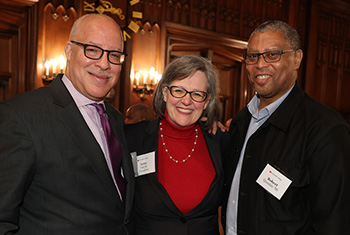 President Anne F. Harris poses with Robert Quashie '86 and an another alumnus during the 2023 Chicago Presidential Tour event.