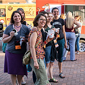 A group of alumni pose with their freshly received Dairy Barn treats from the Dairy Barn food truck during the Reunion Block Party in 2022. 